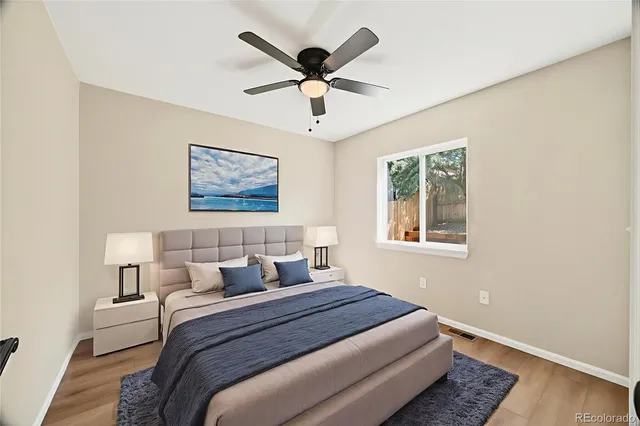 a bedroom with bed and window