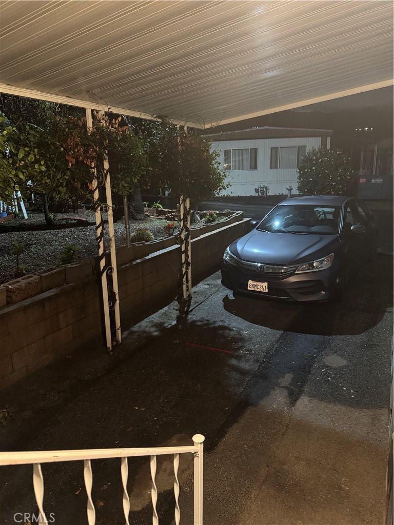 2751 Reche Canyon Road, Unit 185 Moreno Valley, CA 92555 - Photo 16 of 17 a room with water heater and wooden floor