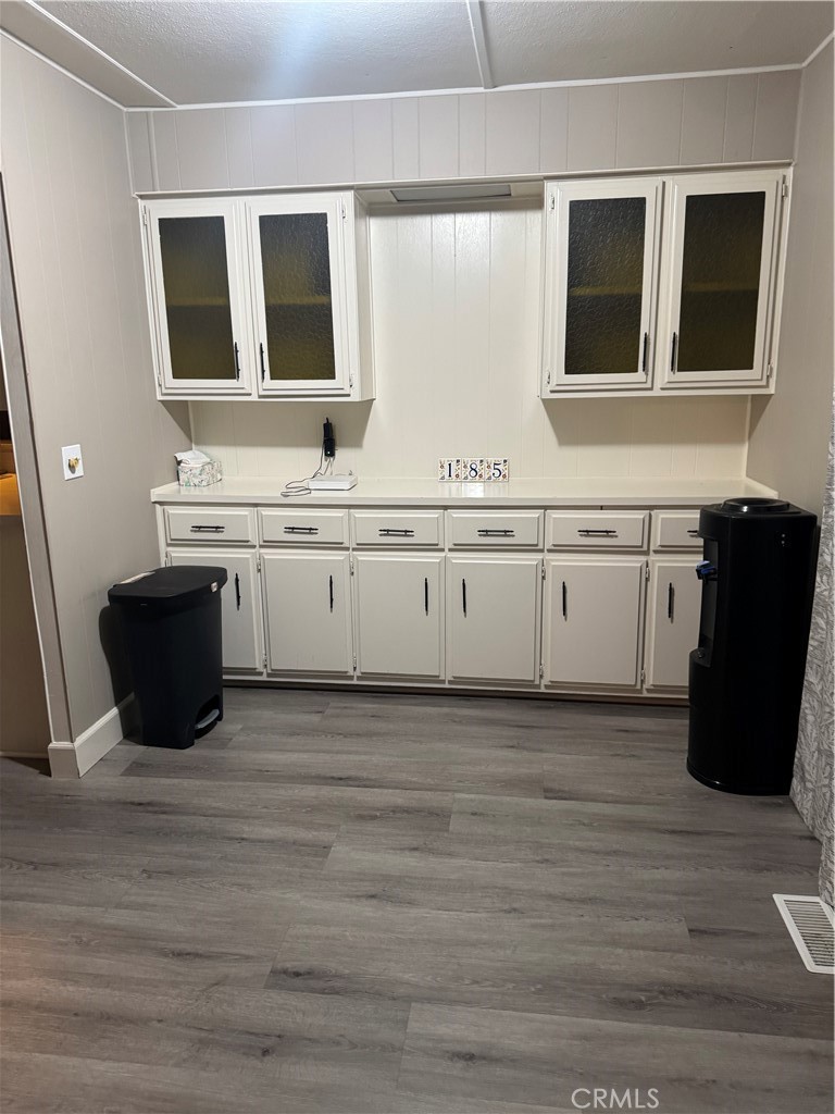 2751 Reche Canyon Road, Unit 185 Moreno Valley, CA 92555 - Photo 5 of 17 a kitchen with granite countertop a sink and a stove