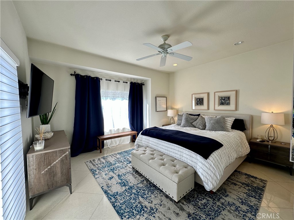 17 Centre Court, Unit 86 Dana Point, CA 92629 - Photo 13 of 21 a spacious bedroom with a large bed and a flat screen television