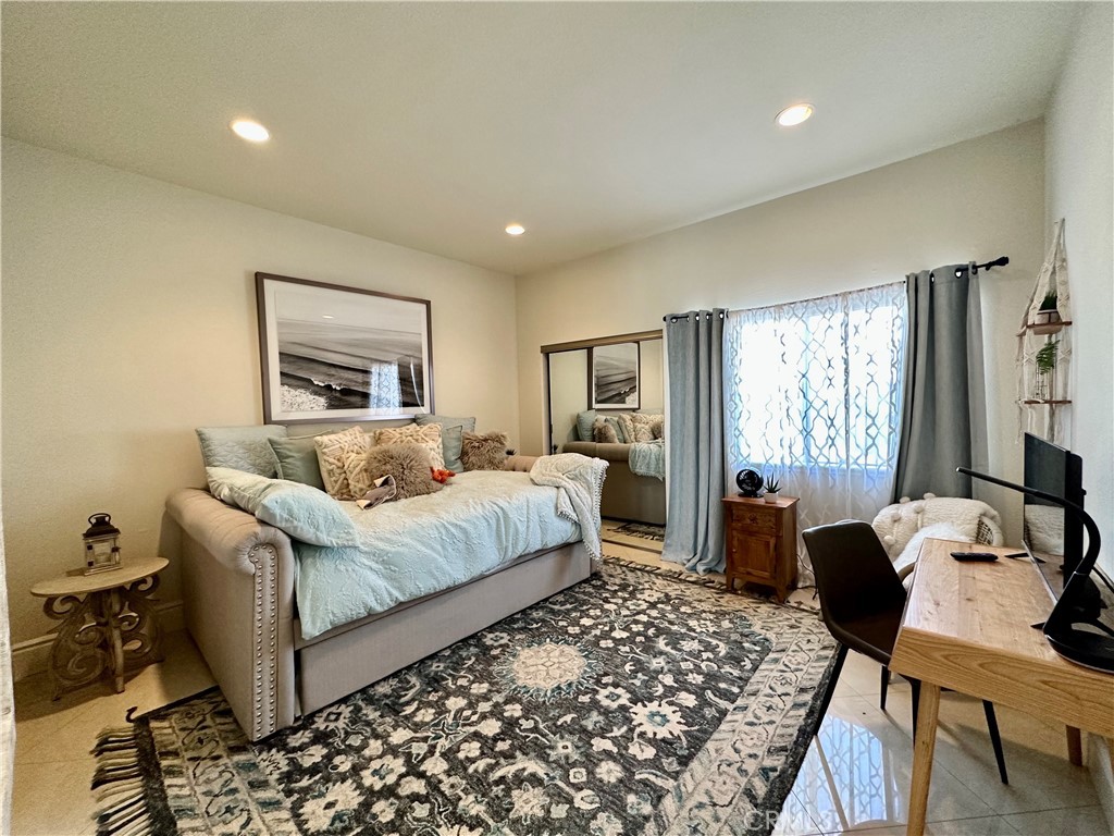 17 Centre Court, Unit 86 Dana Point, CA 92629 - Photo 17 of 21 a bedroom with a bed and wooden floor