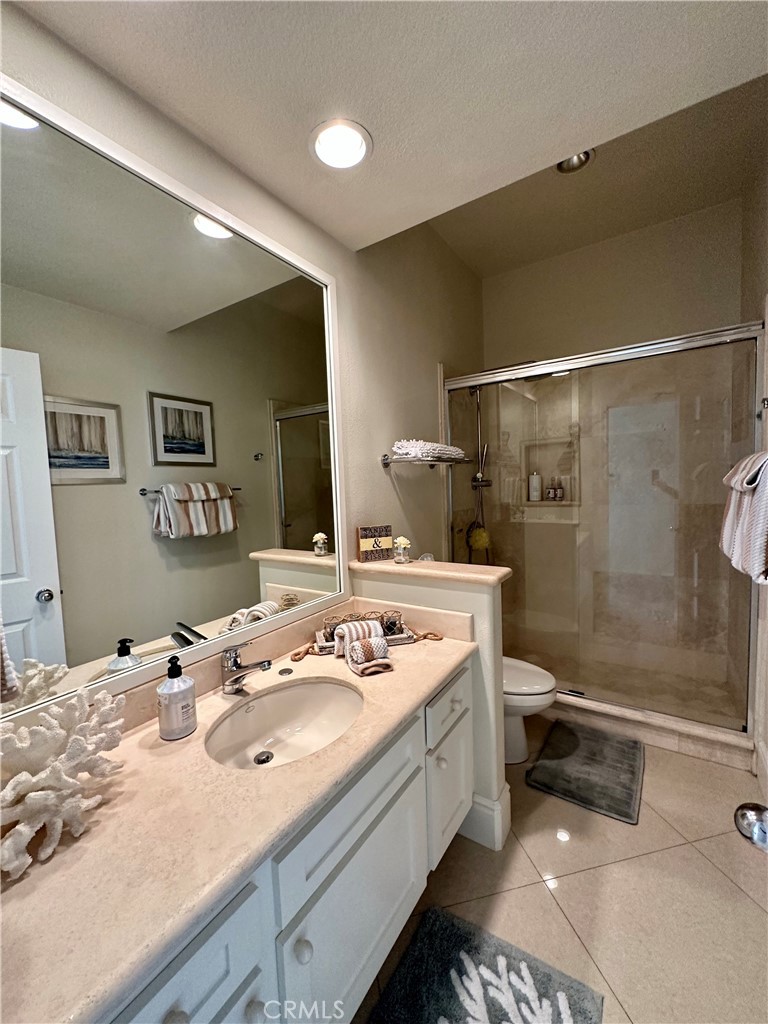 17 Centre Court, Unit 86 Dana Point, CA 92629 - Photo 18 of 21 a bathroom with a sink a toilet and shower