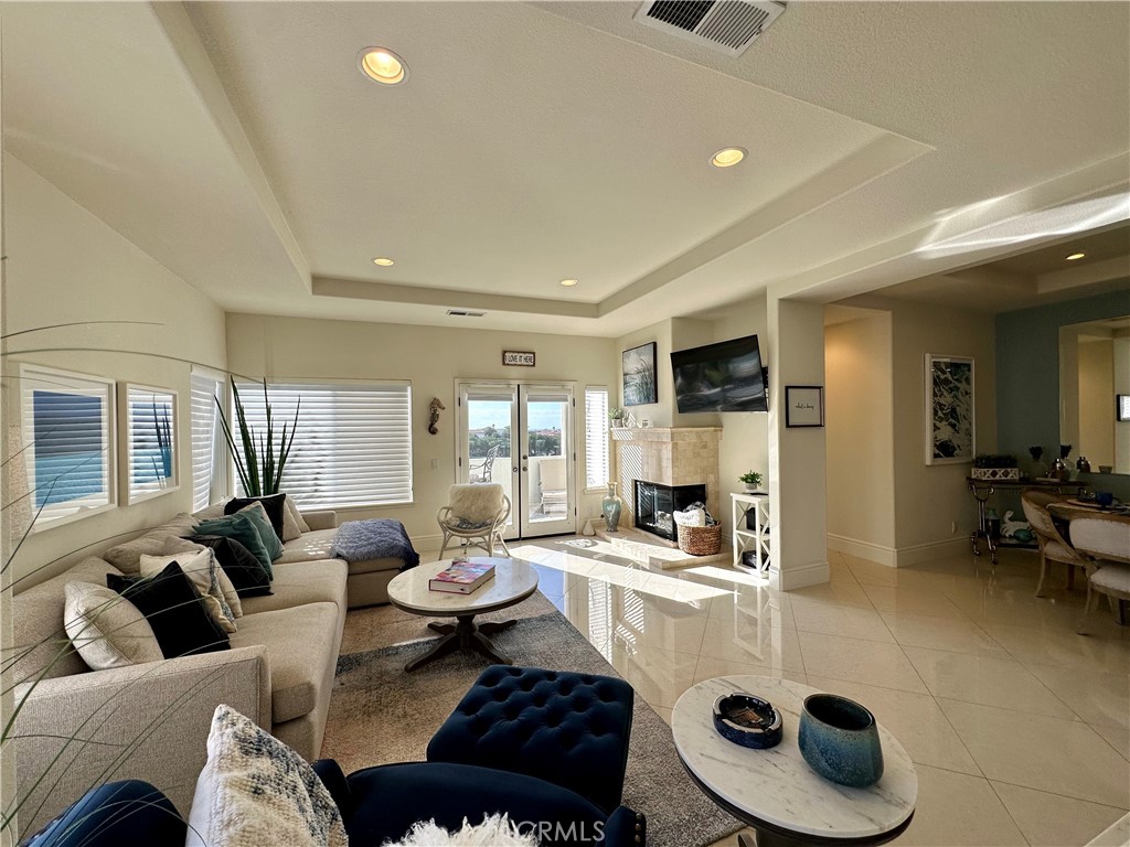 17 Centre Court, Unit 86 Dana Point, CA 92629 - Photo 5 of 21 a living room with furniture and a large window