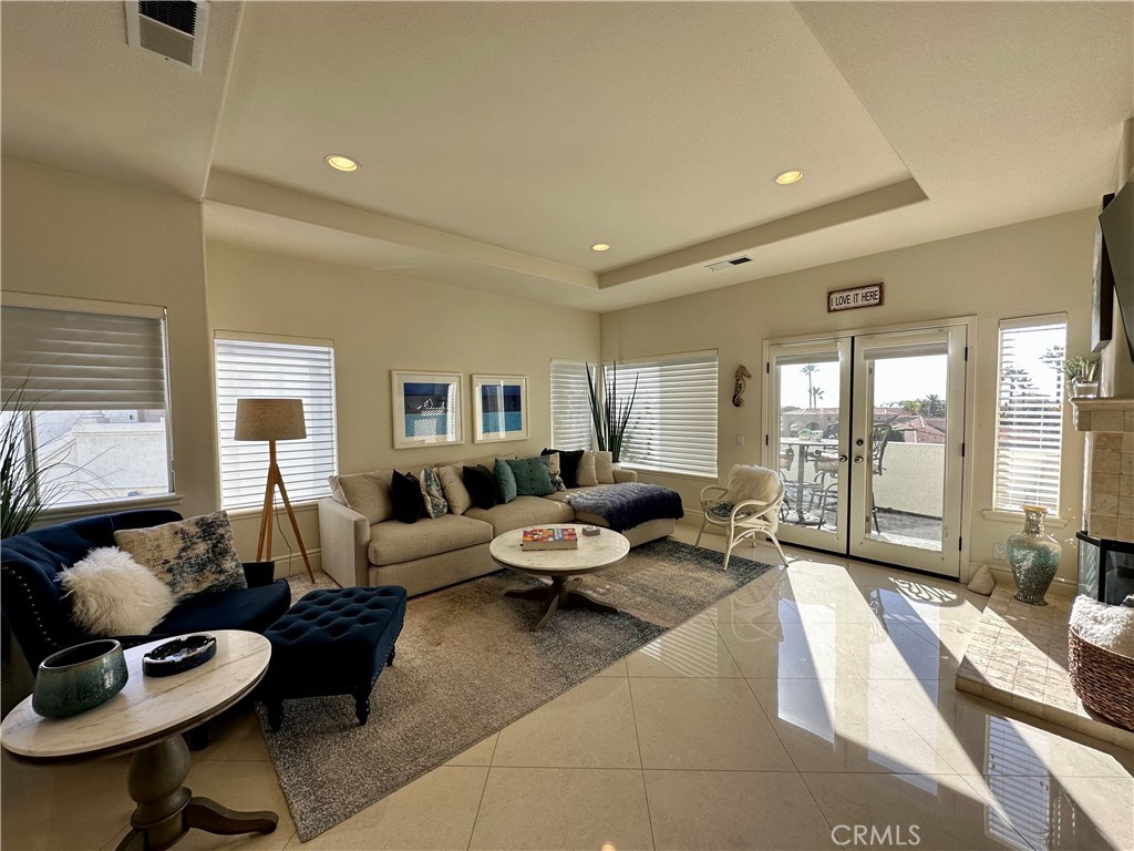 17 Centre Court, Unit 86 Dana Point, CA 92629 - Photo 10 of 21 a living room with furniture and a large window