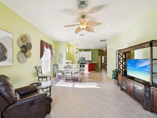 a view of a livingroom with furniture and a flat screen tv