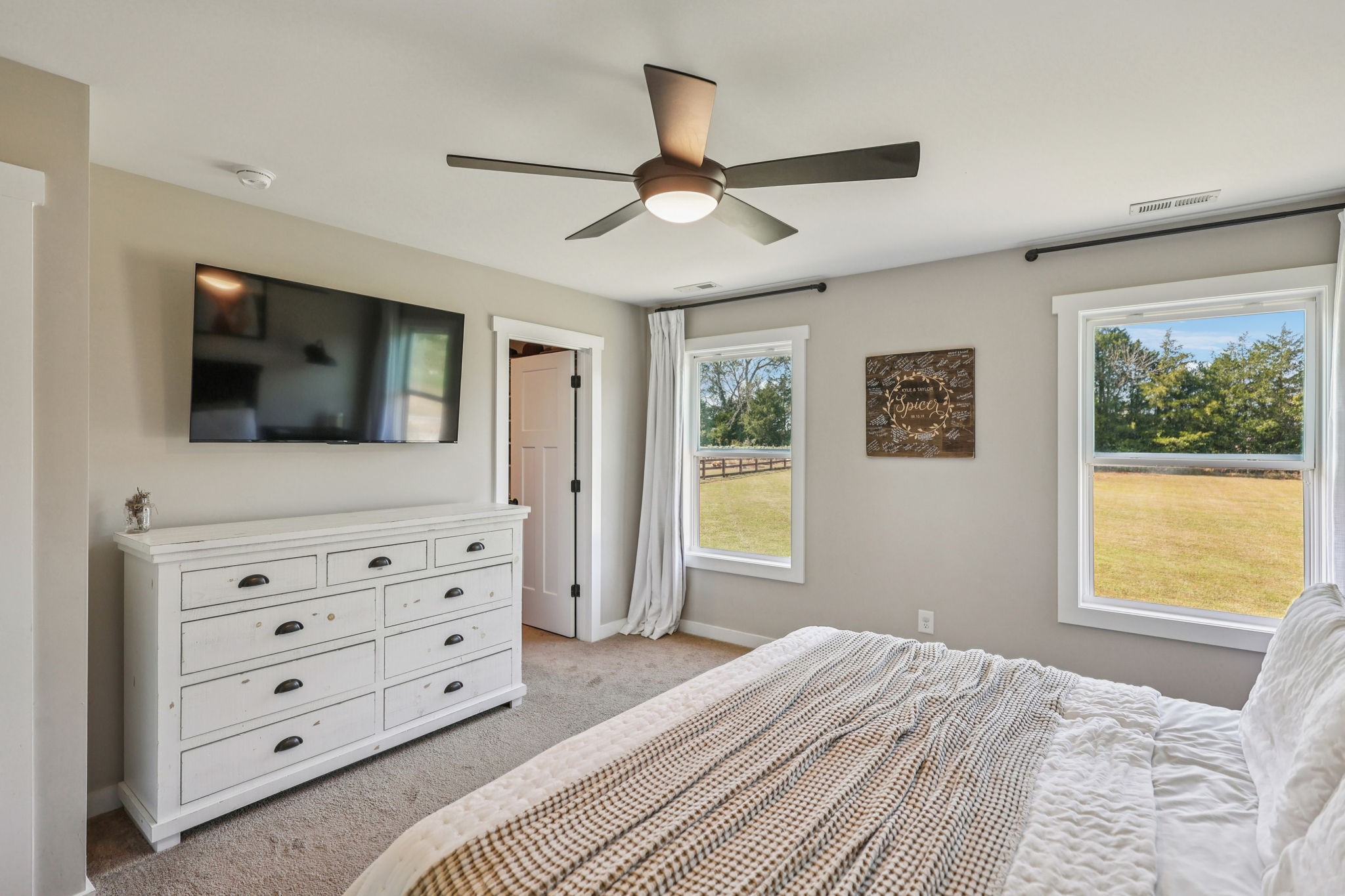 310 Skipping Stone Road Christiana, TN 37037 - Photo 14 of 50 a bedroom with a bed and a flat screen tv