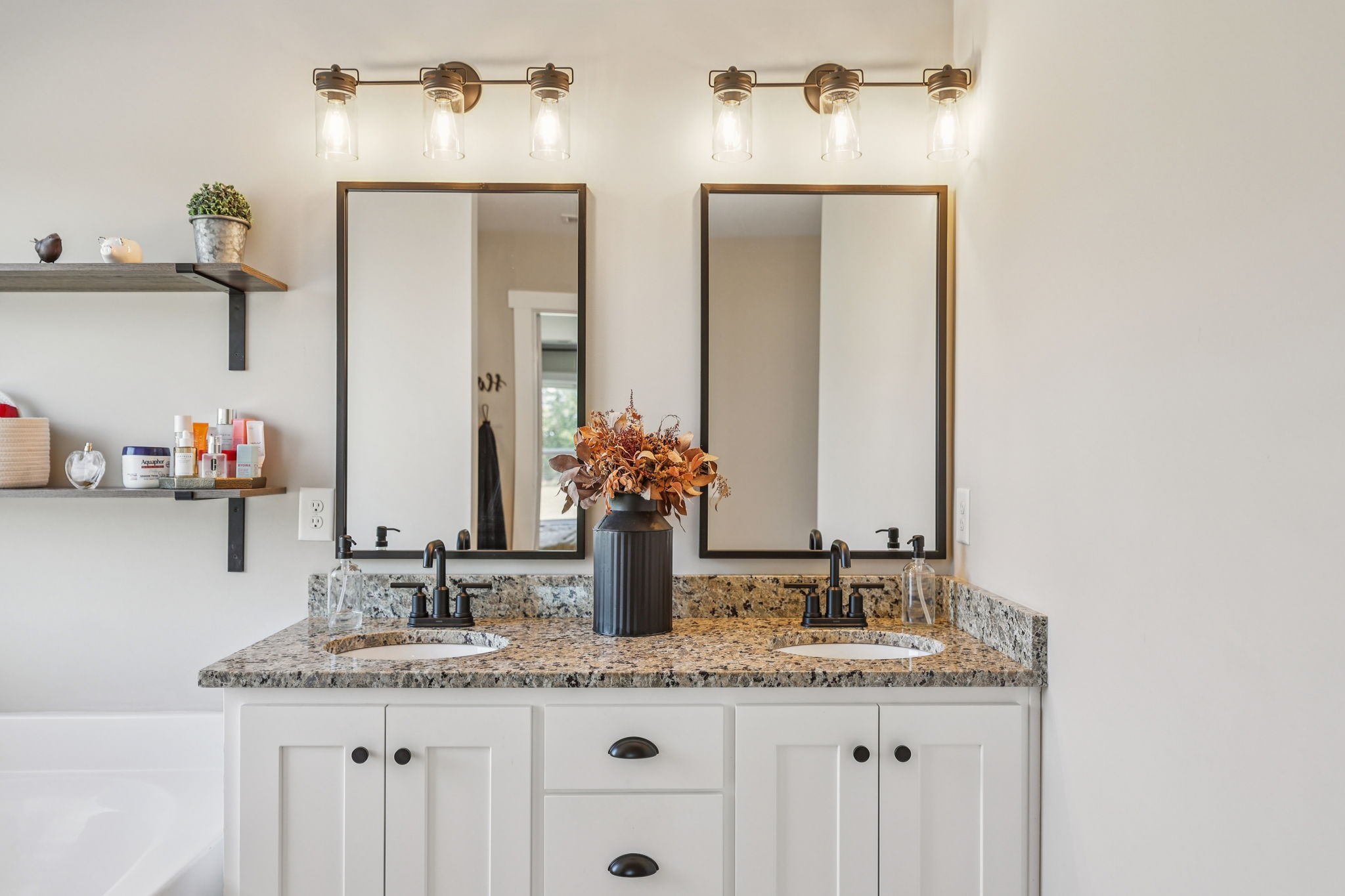 310 Skipping Stone Road Christiana, TN 37037 - Photo 15 of 50 a bathroom with a granite countertop sink and a mirror