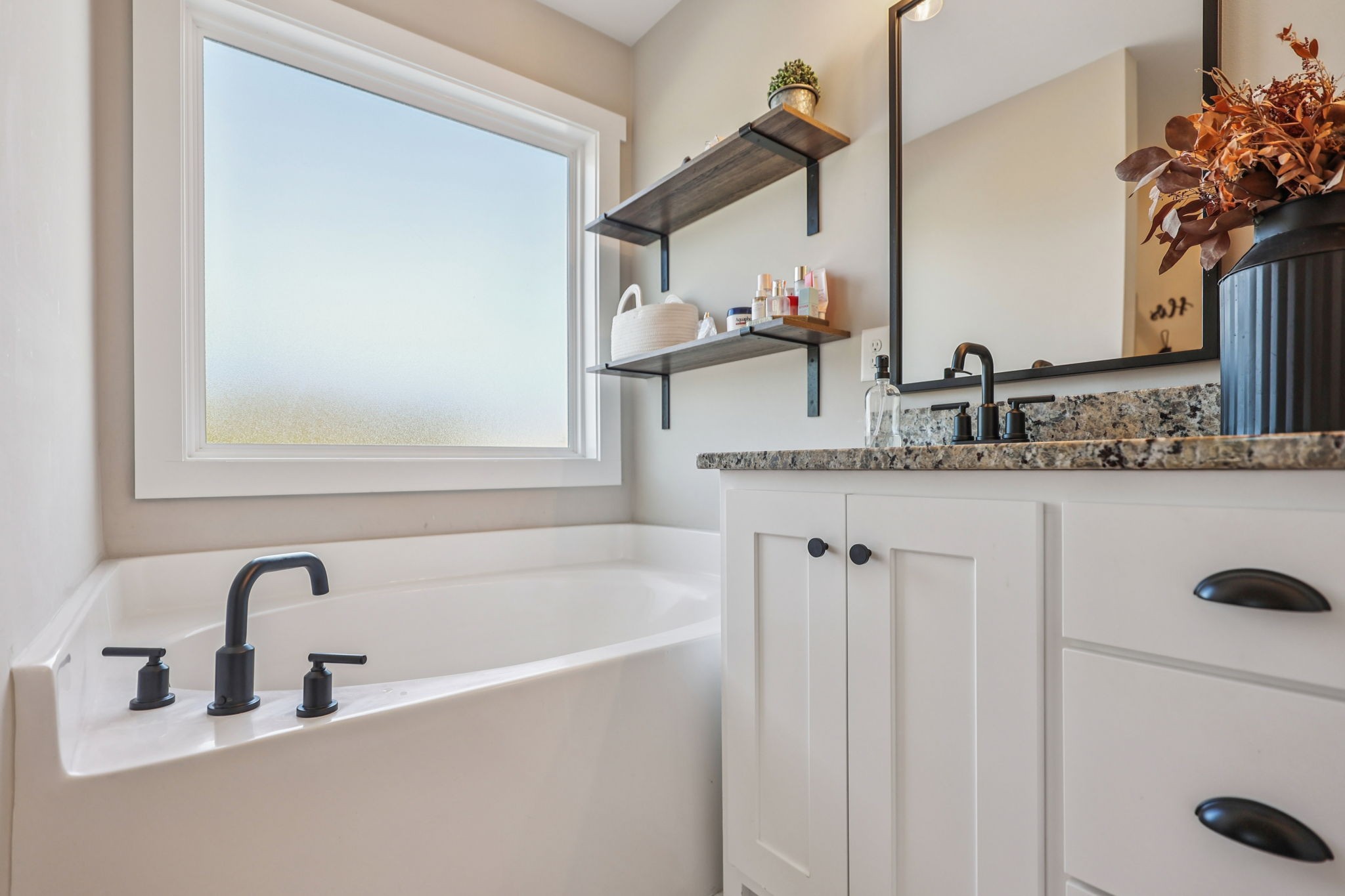 310 Skipping Stone Road Christiana, TN 37037 - Photo 17 of 50 a bathroom with a granite countertop sink and a mirror