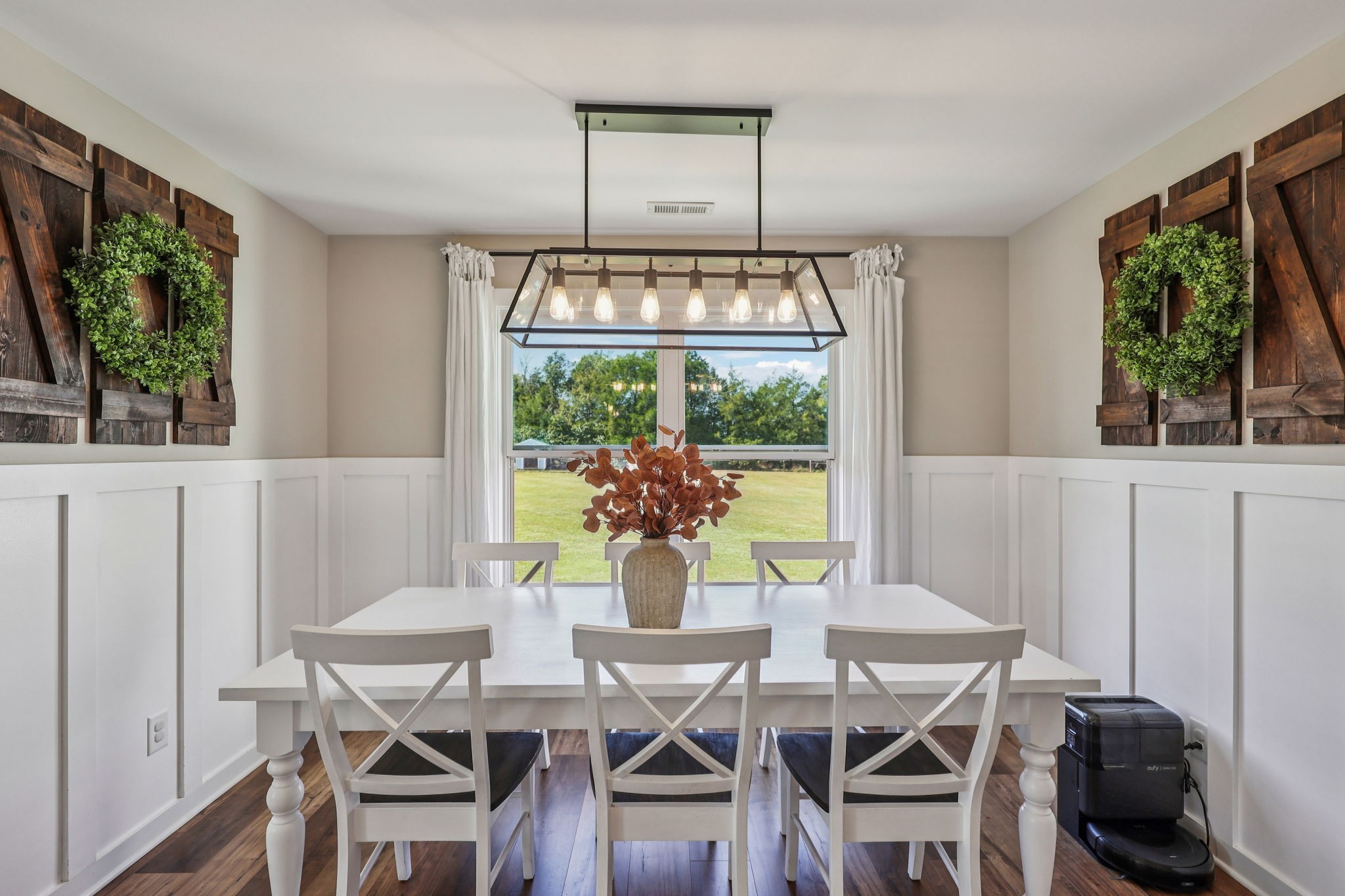 310 Skipping Stone Road Christiana, TN 37037 - Photo 23 of 50 a view of a dining room with furniture a chandelier and wooden floor