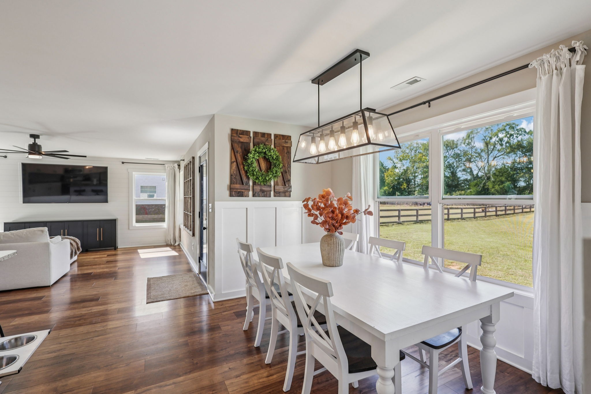 310 Skipping Stone Road Christiana, TN 37037 - Photo 24 of 50 a view of a dining room with furniture window and wooden floor