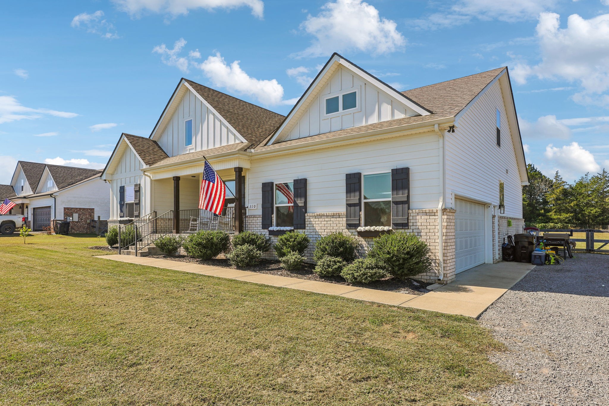 310 Skipping Stone Road Christiana, TN 37037 - Photo 3 of 50 a front view of a house with a yard