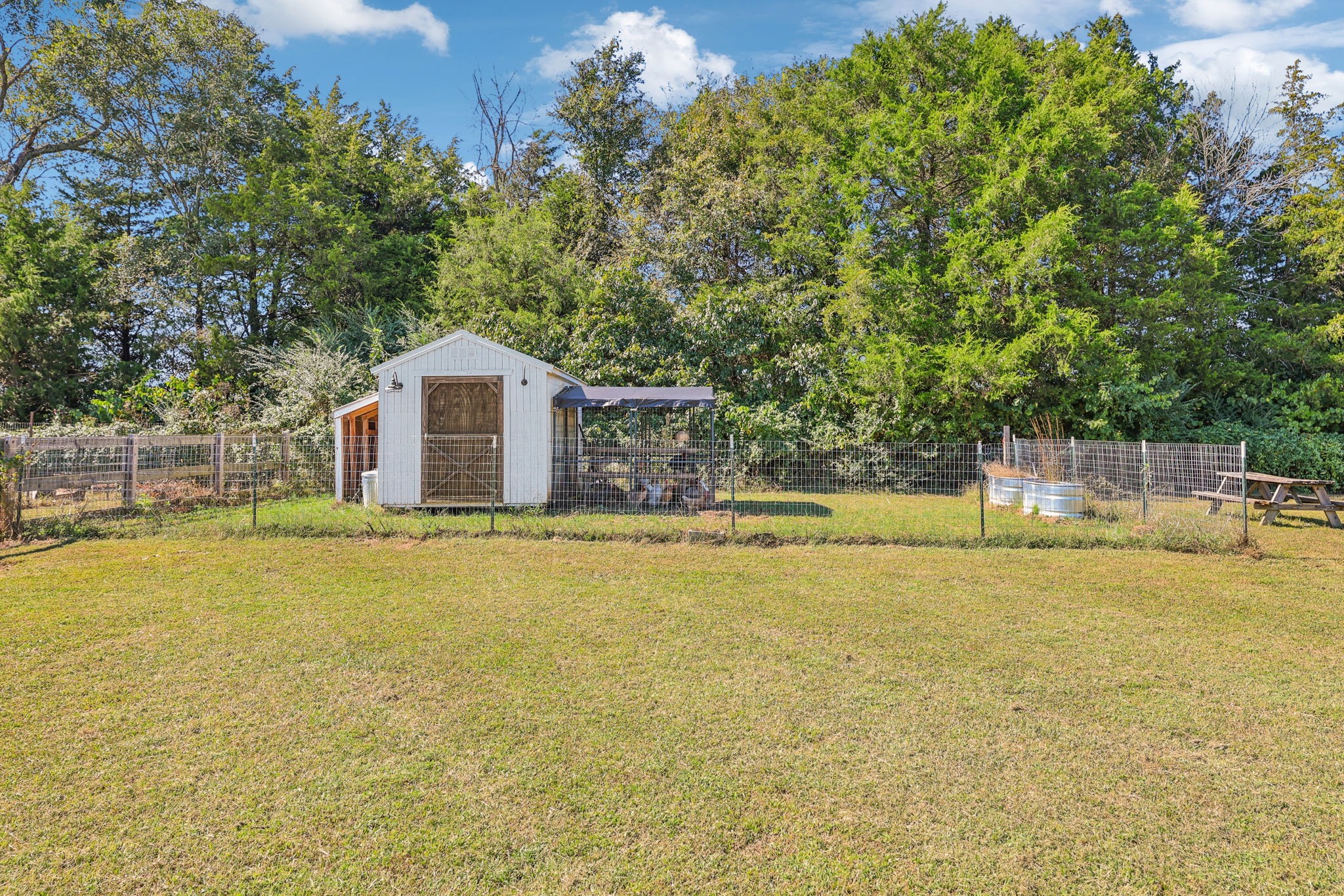 310 Skipping Stone Road Christiana, TN 37037 - Photo 37 of 50 a view of a swimming pool with an outdoor space and seating area