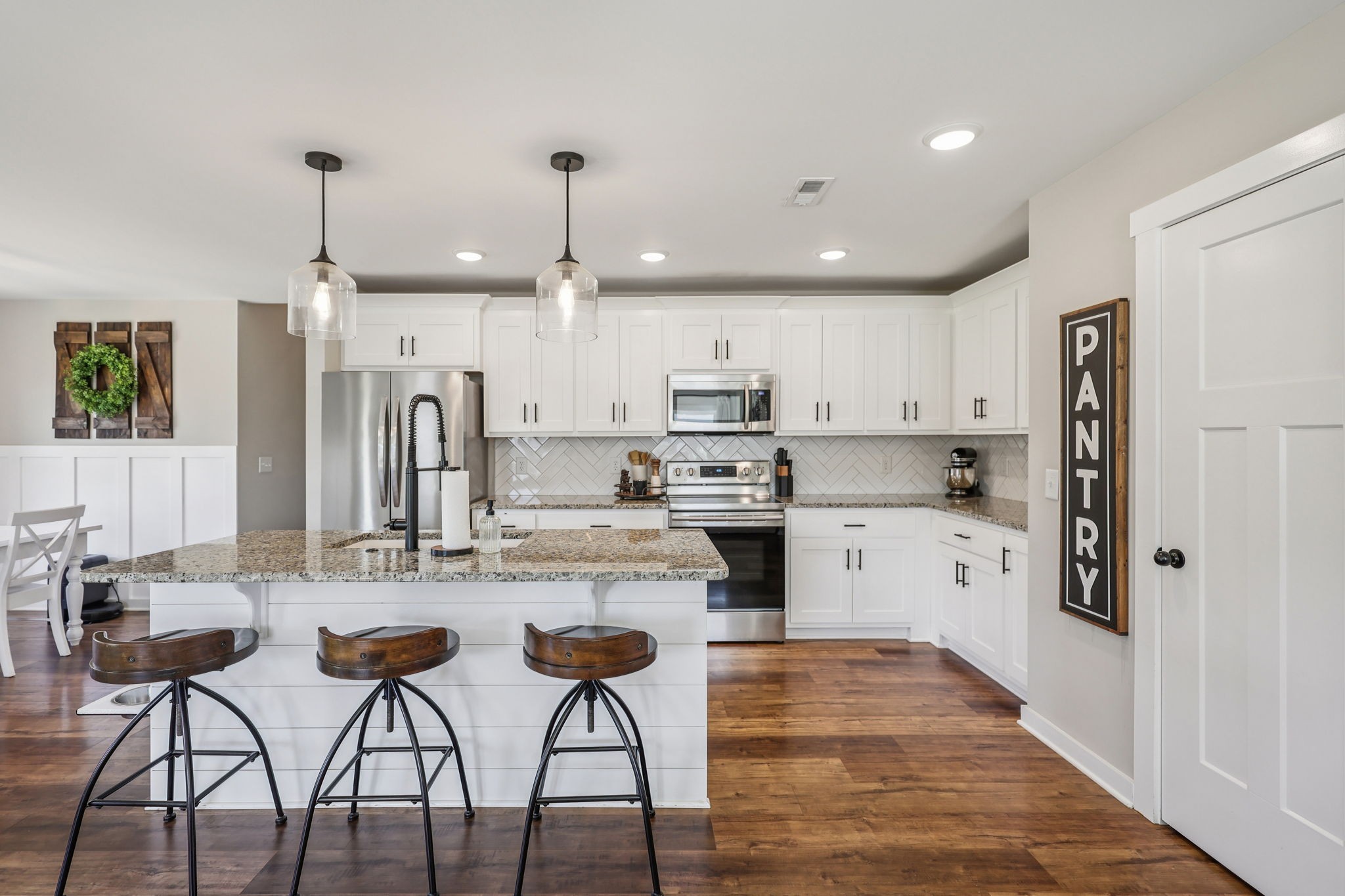 310 Skipping Stone Road Christiana, TN 37037 - Photo 7 of 50 a kitchen with white cabinets and refrigerator