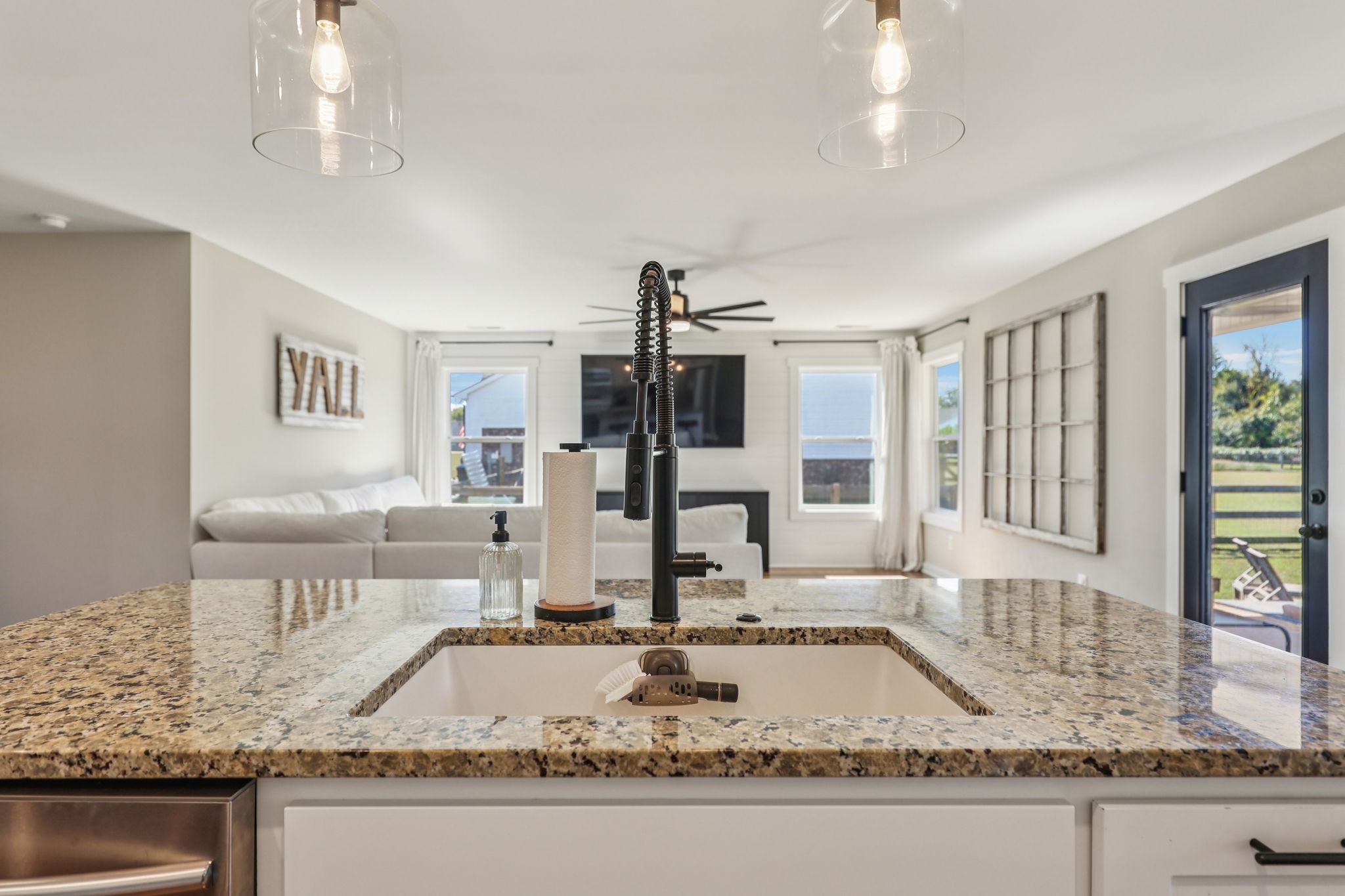 310 Skipping Stone Road Christiana, TN 37037 - Photo 10 of 50 a kitchen with kitchen island granite countertop a sink and a counter top space