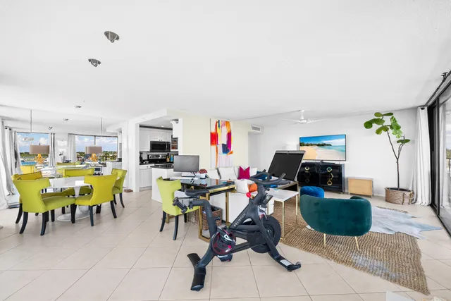 a bedroom with a bed and a flat tv screen on dresser