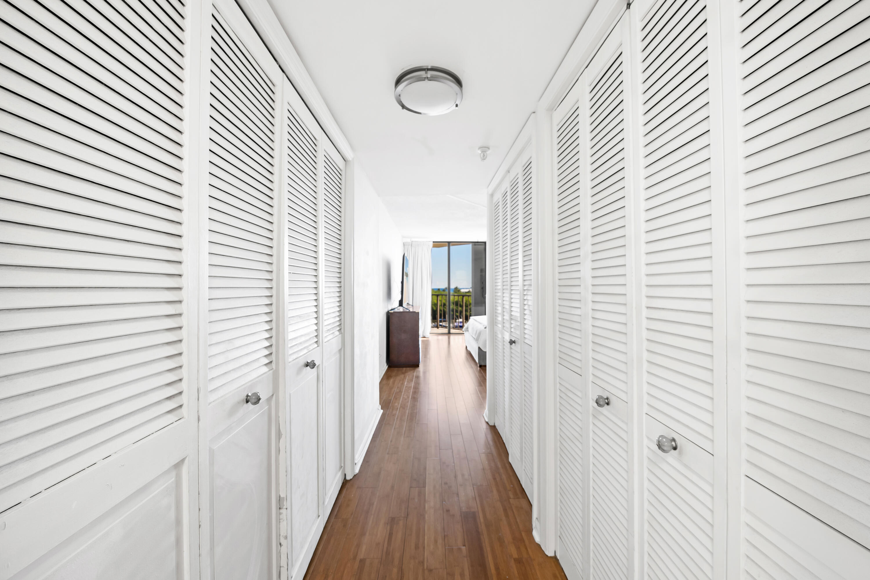 899 Jeffery Street, Unit 614 Boca Raton, FL 33487 - Photo 18 of 60 a view of a hallway with wooden floor