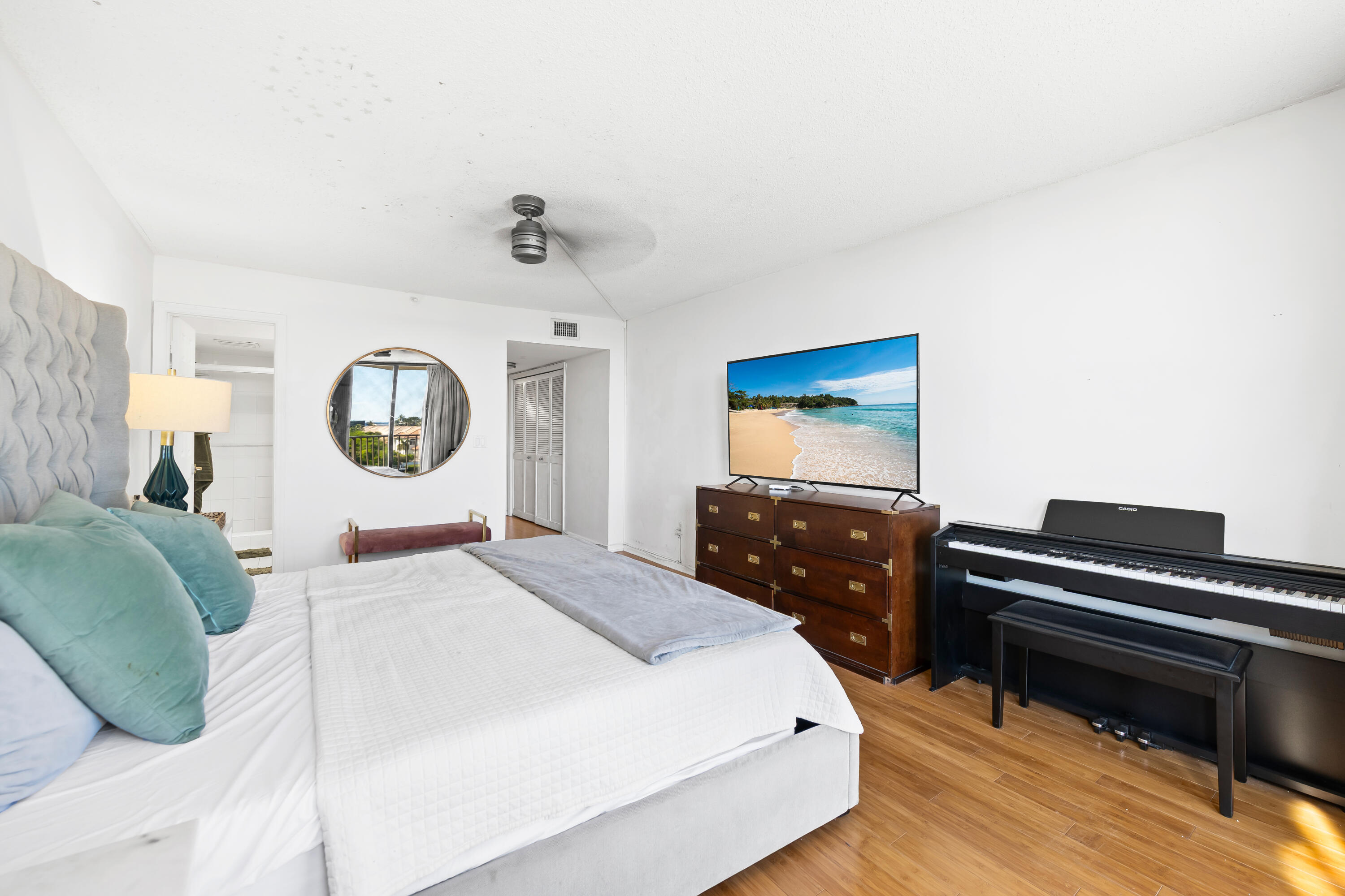 899 Jeffery Street, Unit 614 Boca Raton, FL 33487 - Photo 20 of 60 a bedroom with a bed and a dresser