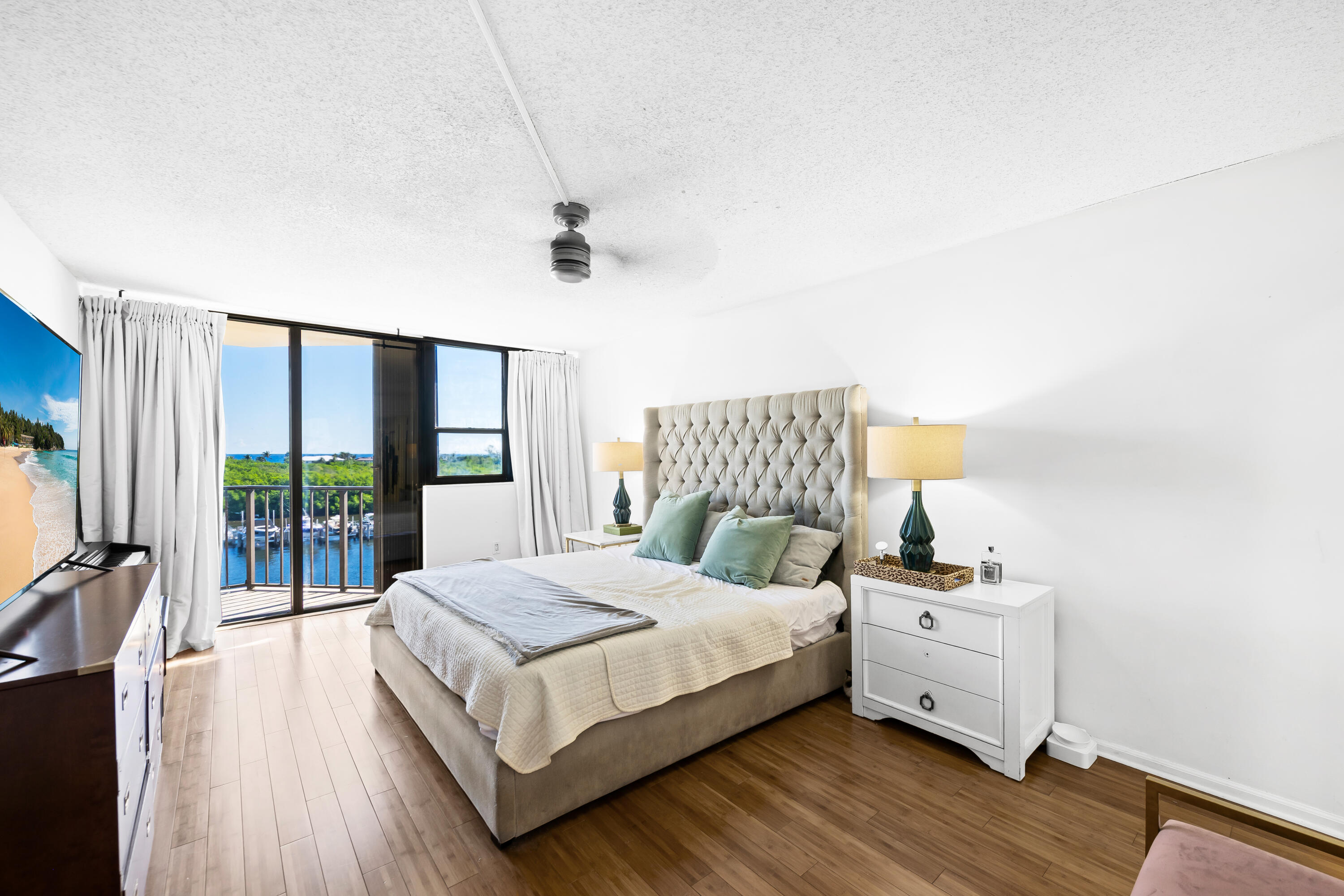 899 Jeffery Street, Unit 614 Boca Raton, FL 33487 - Photo 21 of 60 a bedroom with a bed and a large window