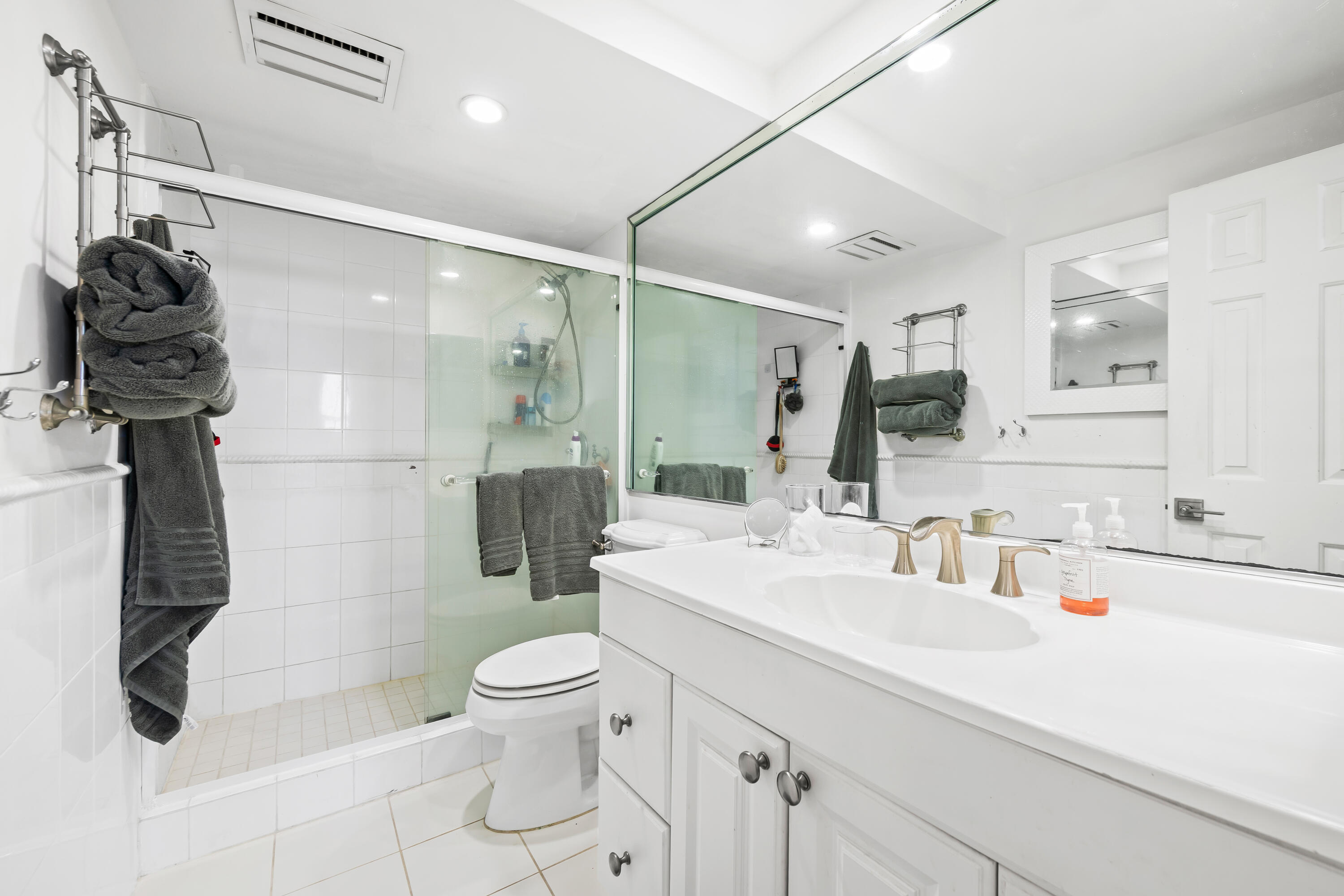 899 Jeffery Street, Unit 614 Boca Raton, FL 33487 - Photo 22 of 60 a bathroom with a sink a toilet and shower