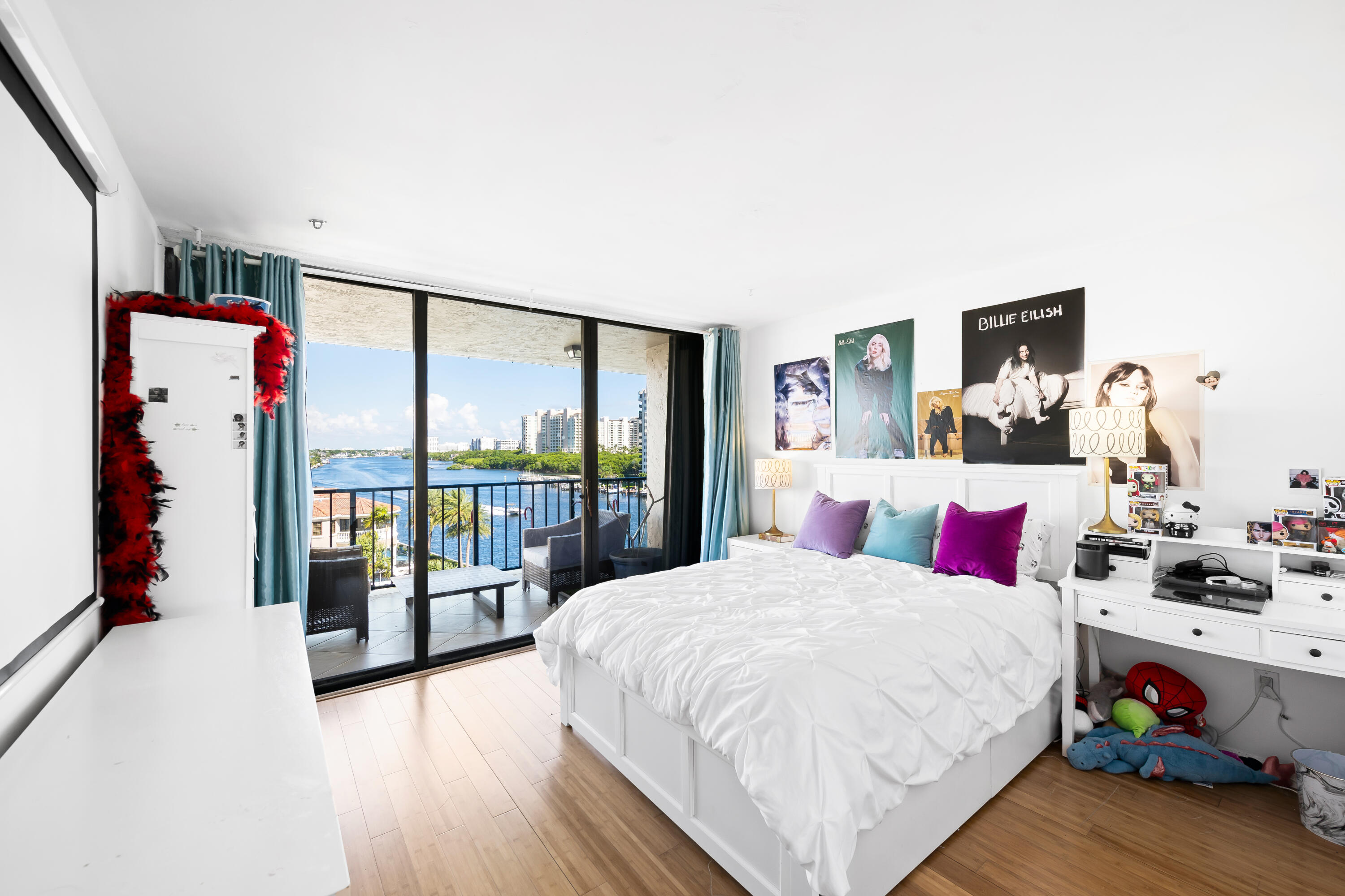 899 Jeffery Street, Unit 614 Boca Raton, FL 33487 - Photo 23 of 60 a bedroom with a large bed and a large window