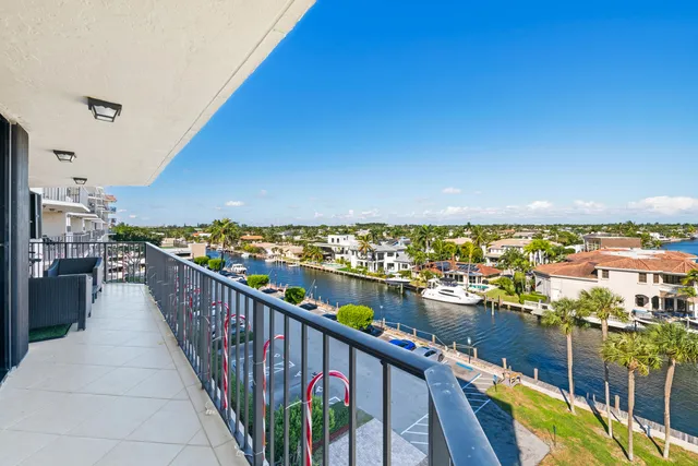 a view of a balcony with chairs
