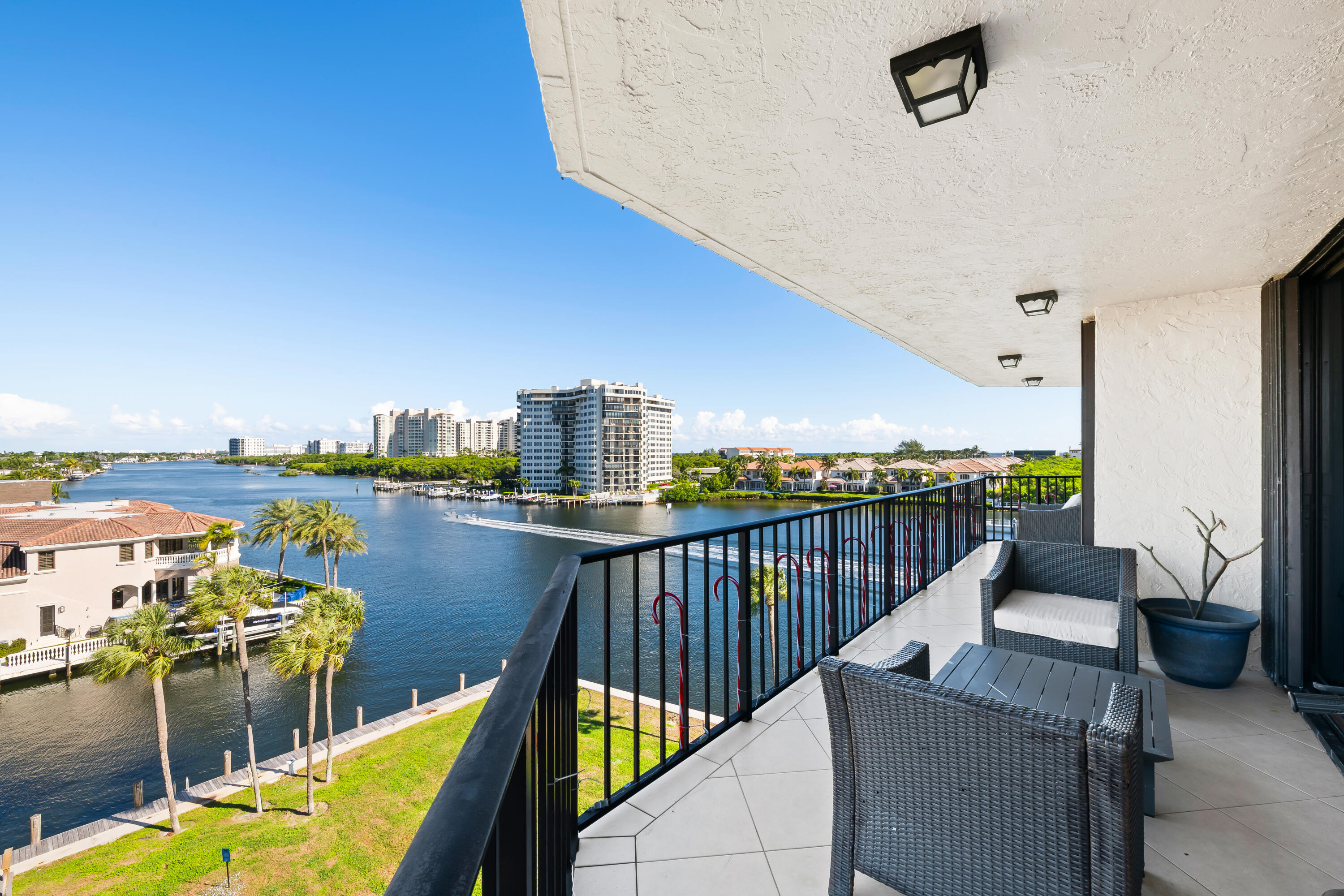 899 Jeffery Street, Unit 614 Boca Raton, FL 33487 - Photo 6 of 60 a view of a balcony with chairs