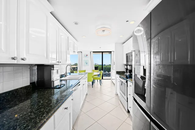 a kitchen with a sink and a large window