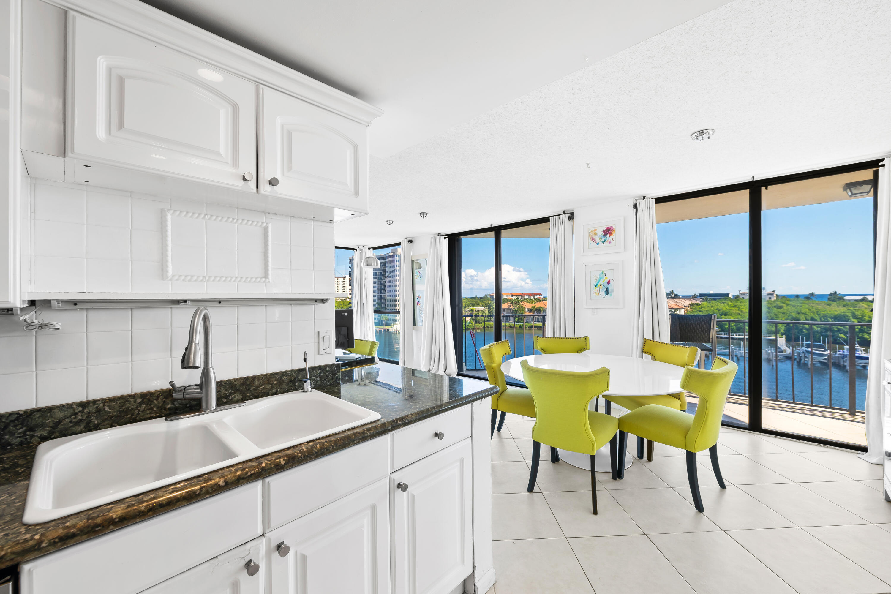 899 Jeffery Street, Unit 614 Boca Raton, FL 33487 - Photo 10 of 60 a kitchen with a sink and a large window