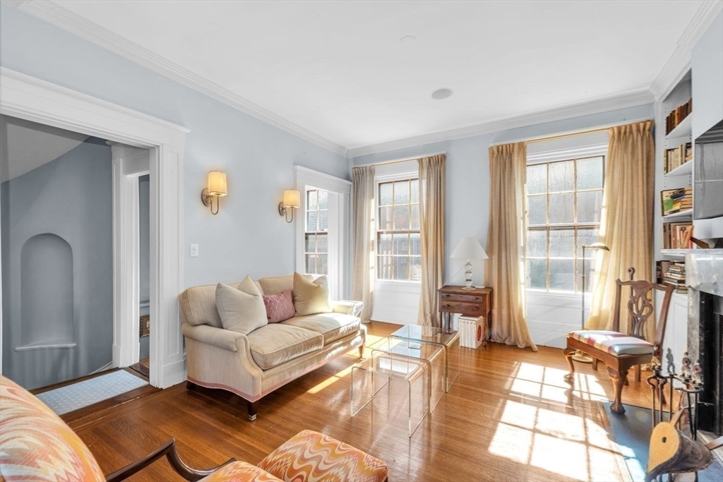 52 River Street Boston, MA 02108 - Photo 16 of 37 a living room with furniture and a floor to ceiling window