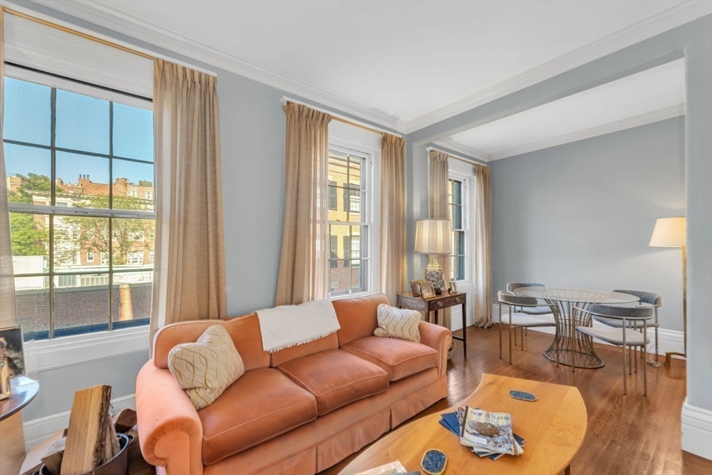 52 River Street Boston, MA 02108 - Photo 20 of 37 a living room with furniture and a large window