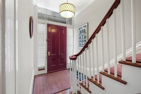 a view of entryway with wooden floor