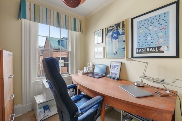 52 River Street Boston, MA 02108 - Photo 27 of 37 a view of a workspace with furniture and a couch