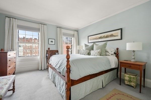 a bed room with a bed and a window