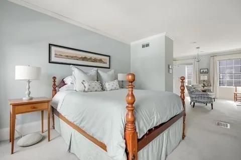 a bedroom with bed and window