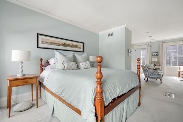 52 River Street Boston, MA 02108 - Photo 29 of 37 a bedroom with bed and window