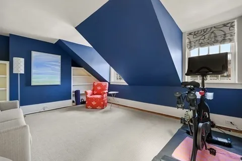 a room with furniture and flat screen tv