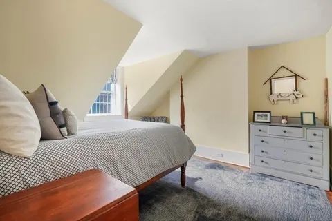 a bedroom with a bed and with mirror