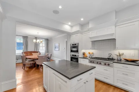 a kitchen with stainless steel appliances granite countertop a lot of counter space and a sink