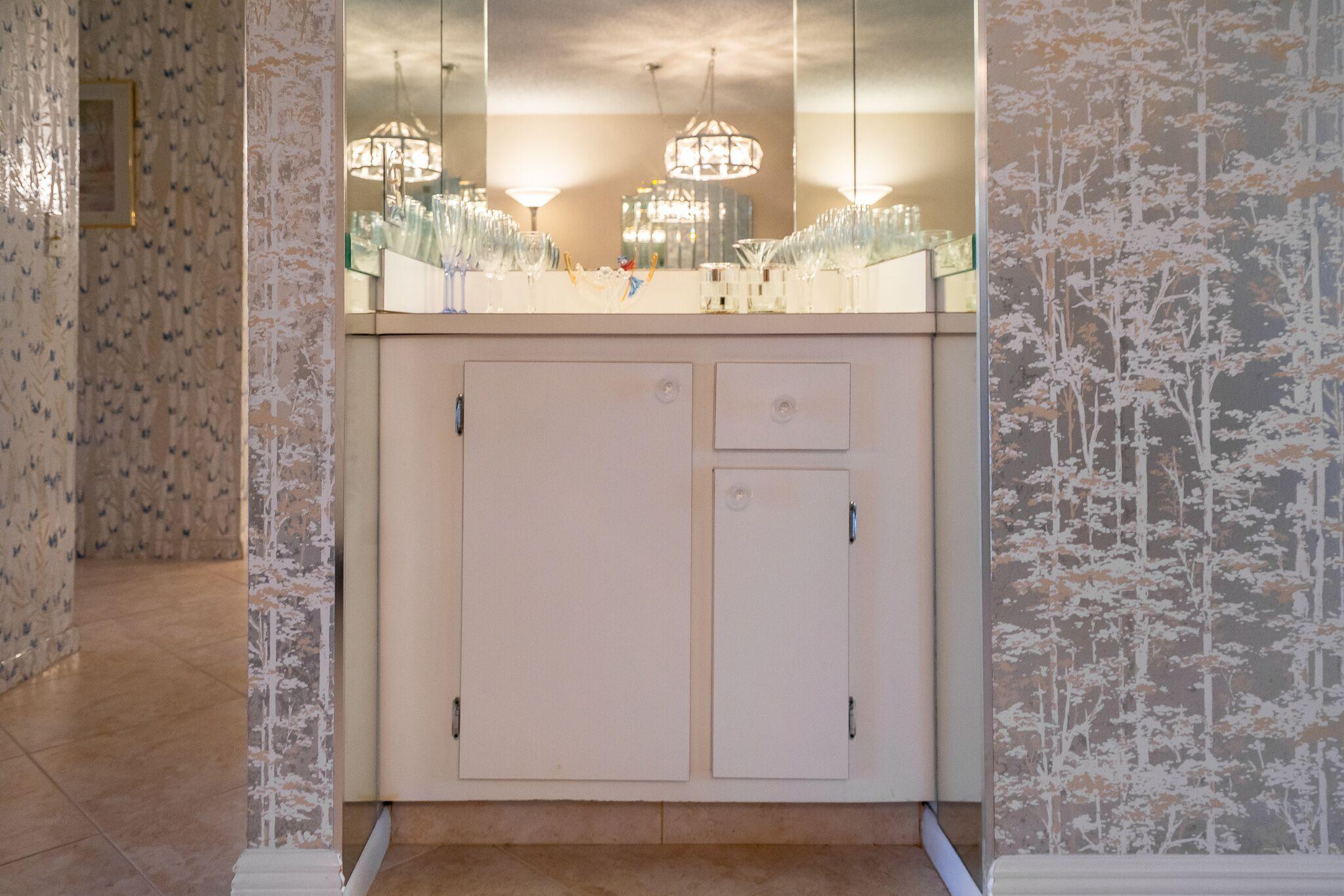 9276 Vista Del Lago, Unit E Boca Raton, FL 33428 - Photo 14 of 23 a bathroom with a mirror