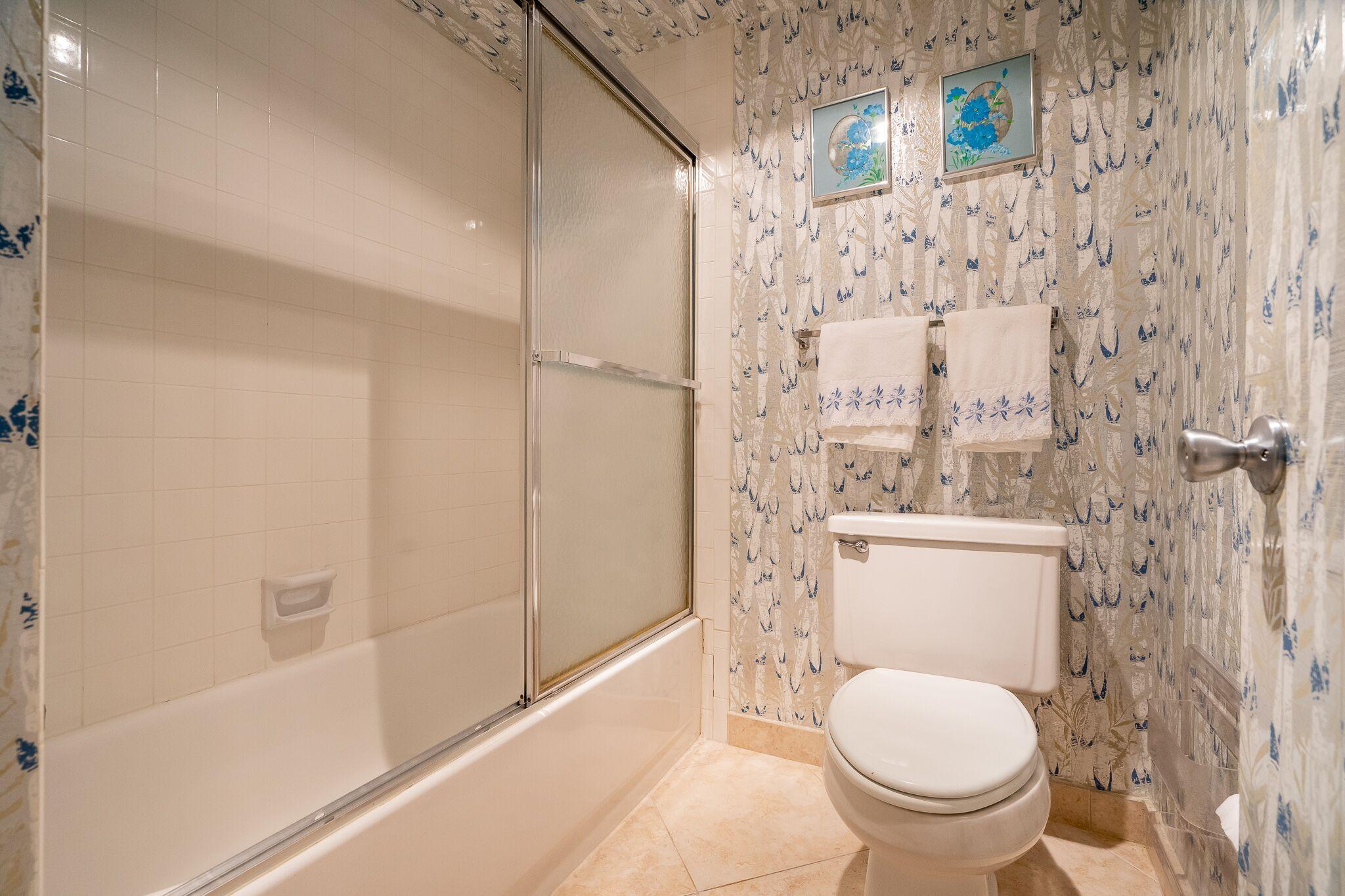 9276 Vista Del Lago, Unit E Boca Raton, FL 33428 - Photo 16 of 23 a bathroom with a toilet and a shower