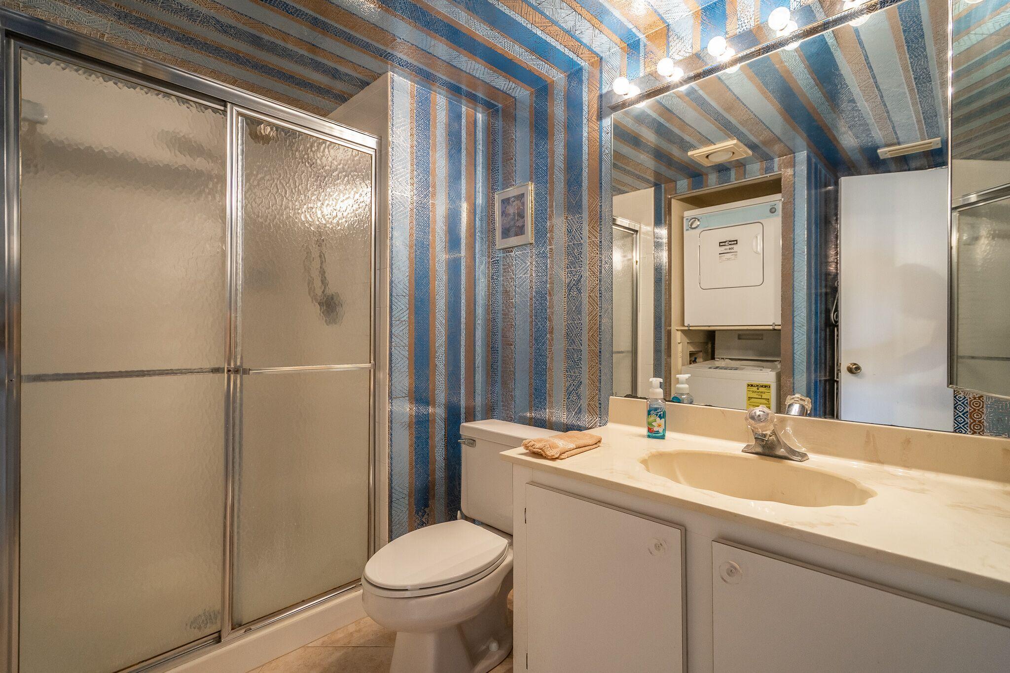 9276 Vista Del Lago, Unit E Boca Raton, FL 33428 - Photo 18 of 23 a bathroom with a sink toilet and shower