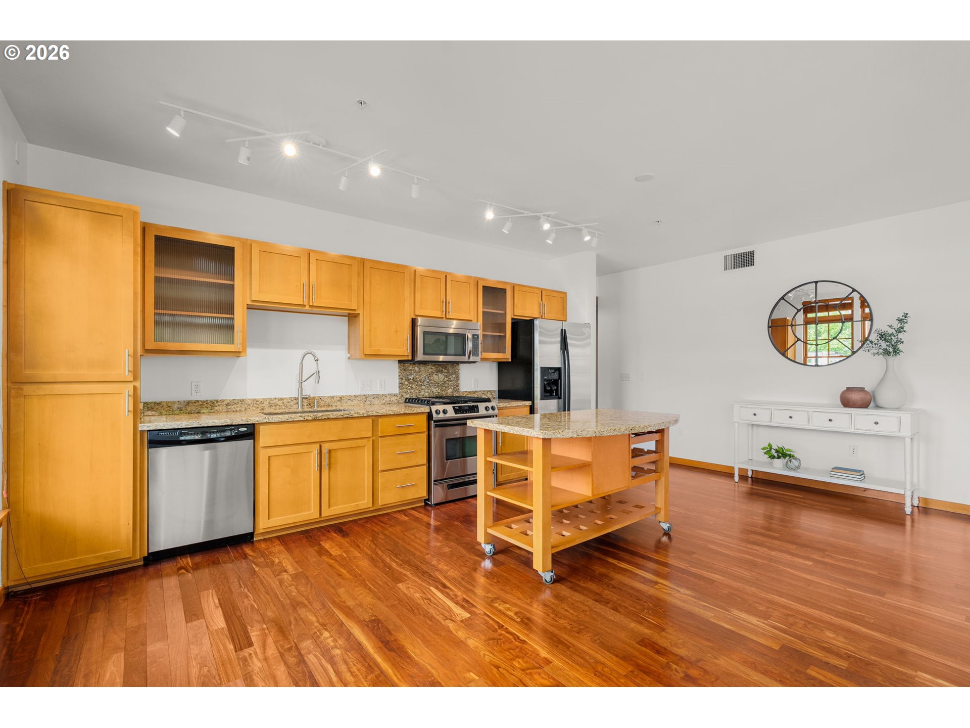 2350 Northwest Savier Street, Unit 224 Portland, OR 97210 - Photo 6 of 19 a kitchen with a sink cabinets and wooden floor