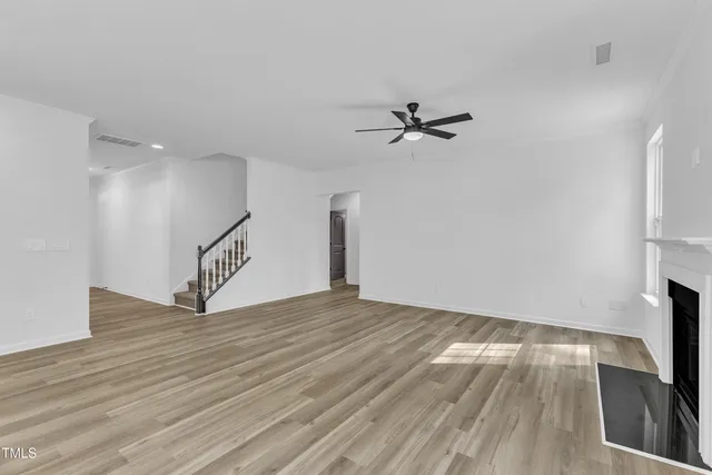 a bathroom with double vanity sinks and a mirror