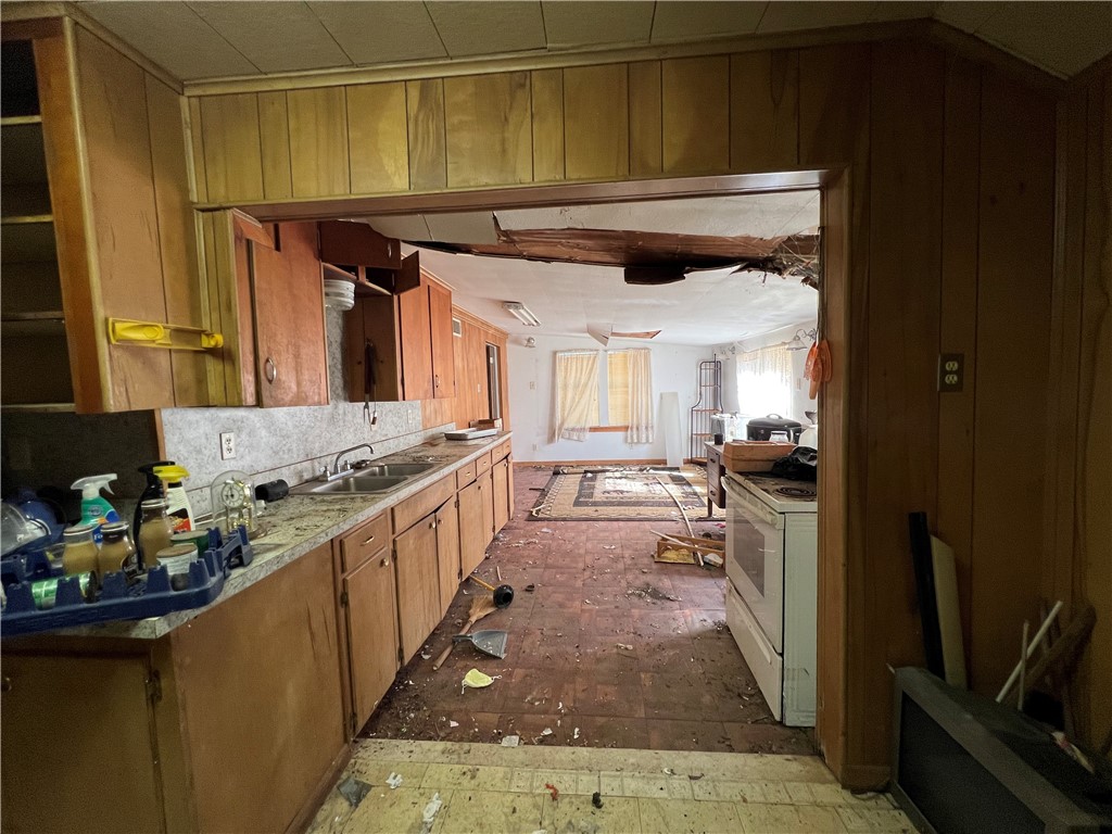 113 4th Street Mathis, TX 78368 - Photo 11 of 26 a kitchen with stainless steel appliances granite countertop a sink and cabinets