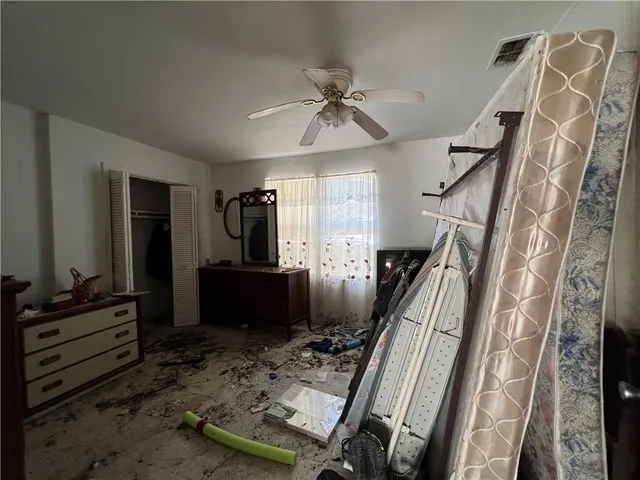 a room with furniture gym equipment and view of living room