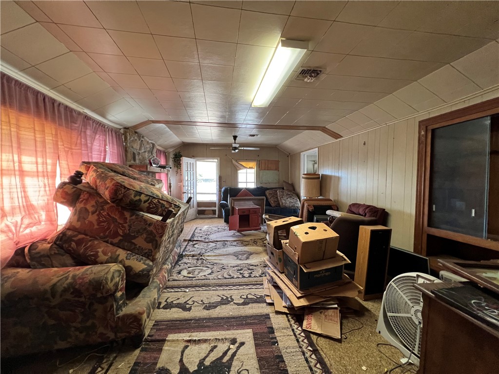 113 4th Street Mathis, TX 78368 - Photo 15 of 26 a room with furniture gym equipment and view of living room