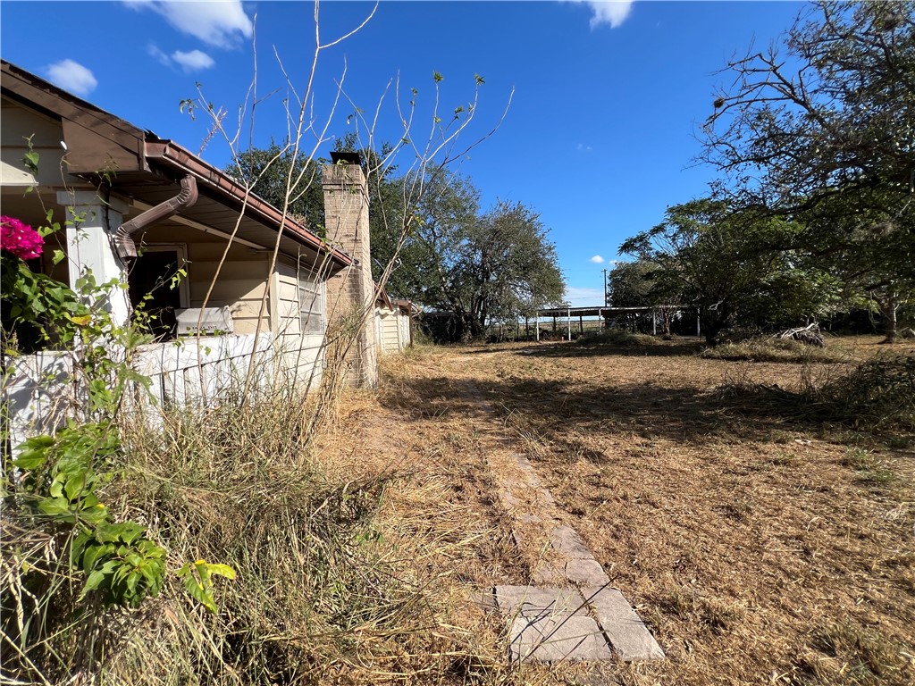 113 4th Street Mathis, TX 78368 - Photo 20 of 26 a view of a backyard of the house