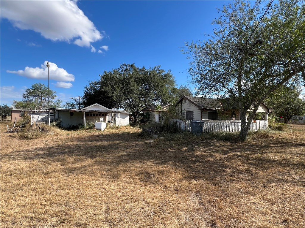 113 4th Street Mathis, TX 78368 - Photo 3 of 26 a front view of a house with a yard