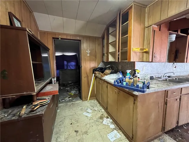 a kitchen with stainless steel appliances granite countertop a sink and cabinets