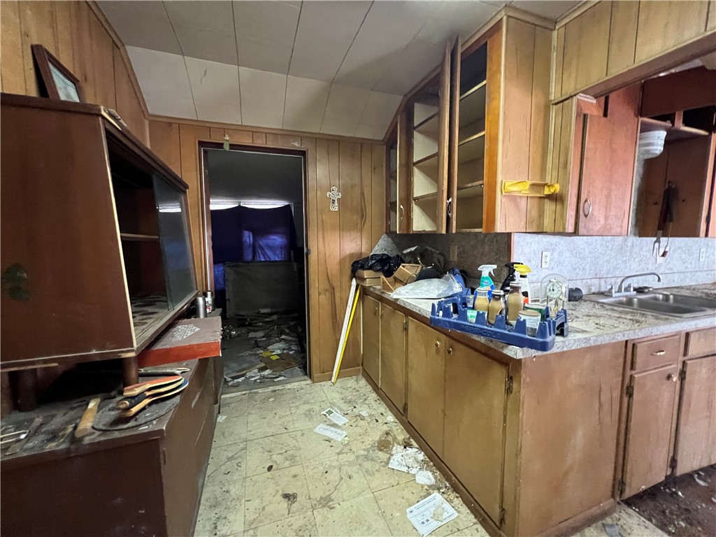 113 4th Street Mathis, TX 78368 - Photo 10 of 26 a kitchen with sink stove and refrigerator